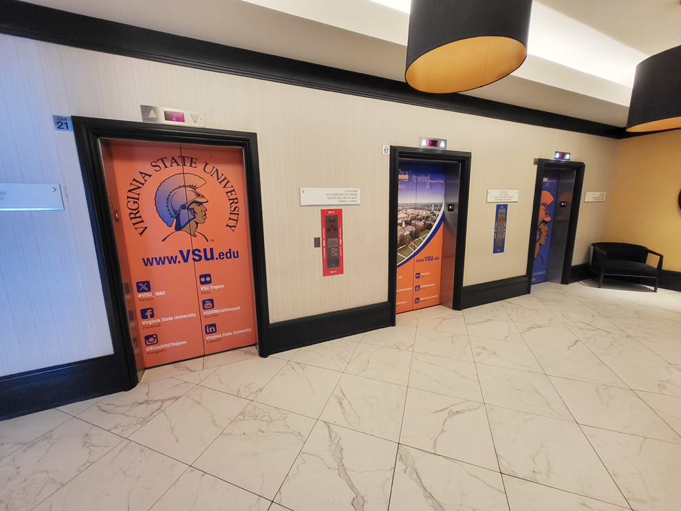Elevator Wraps in Reston, VA designed and installed for corporate office branding and interior graphics