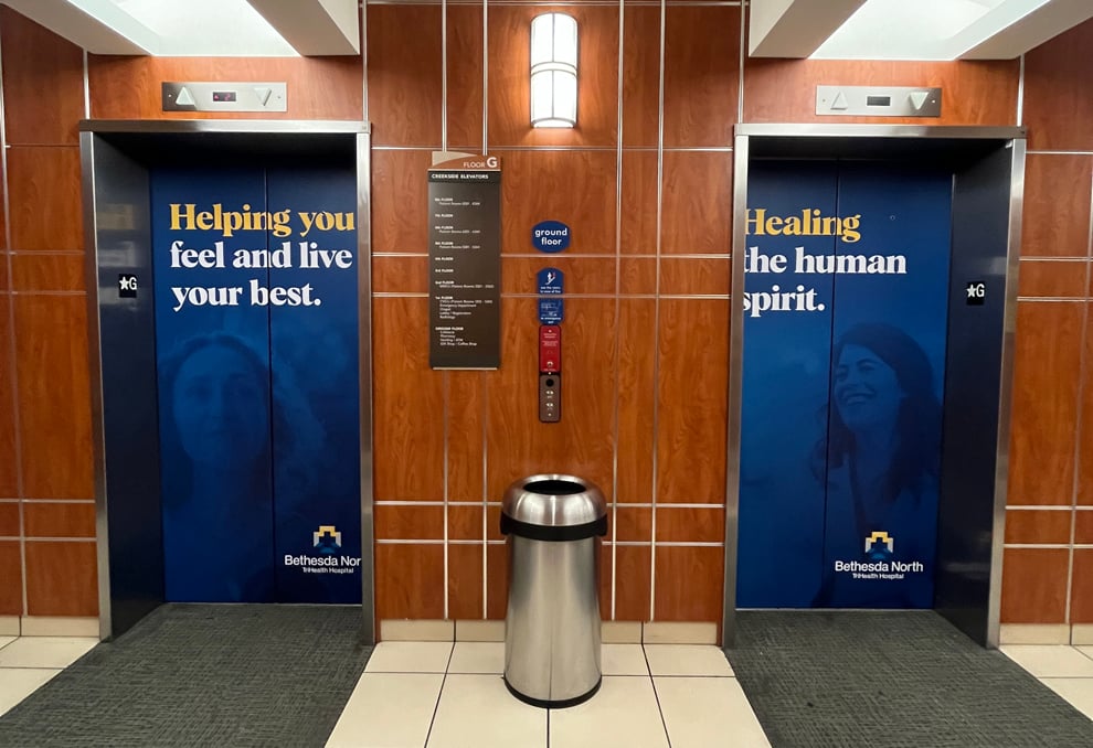 Elevator Wraps in Rockville, MD designed and installed for office cab walls and elevator doors