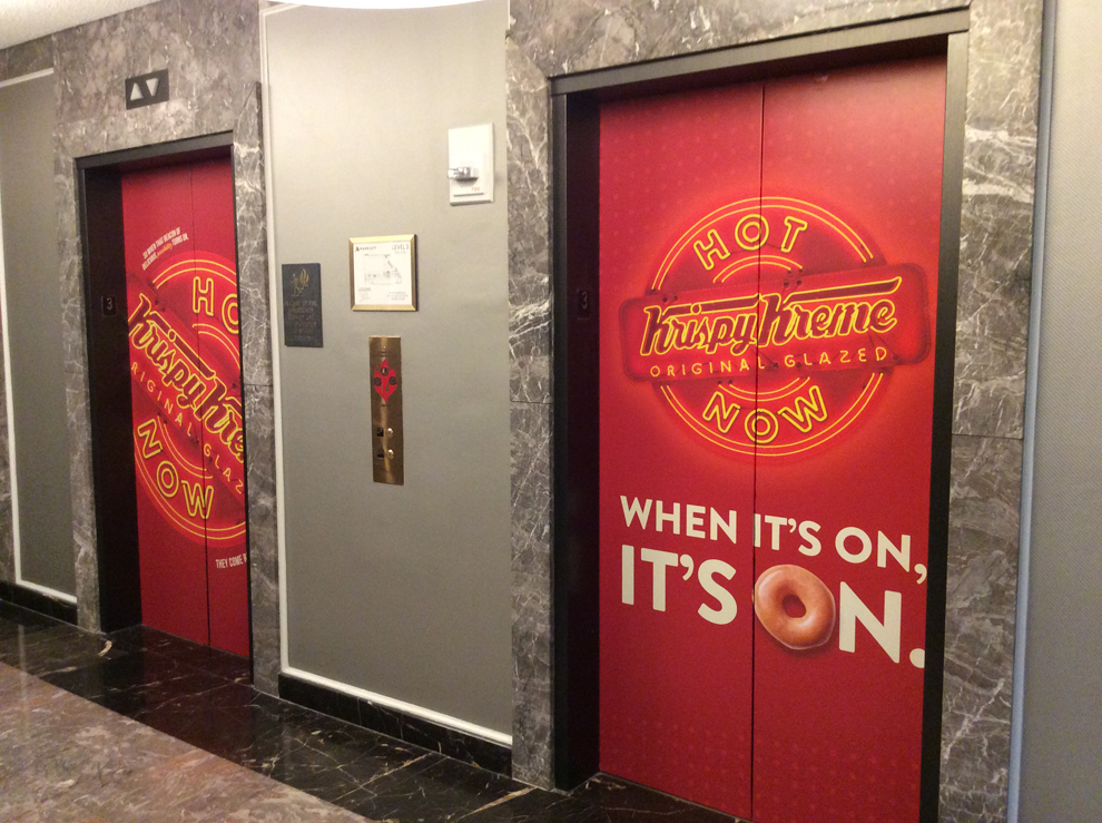 Elevator Wraps in Sterling, VA designed and installed for workplace environments and brand identity