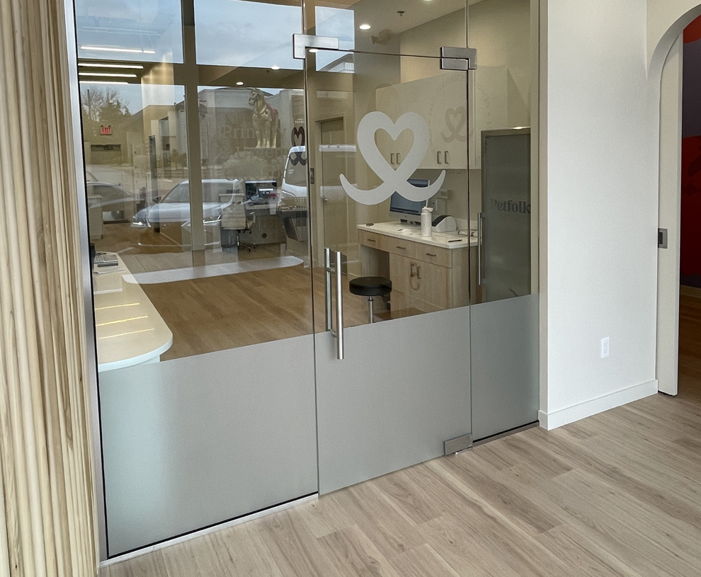 Frosted Vinyl in Rockville, MD designed and installed for branded privacy glass and hallway doors