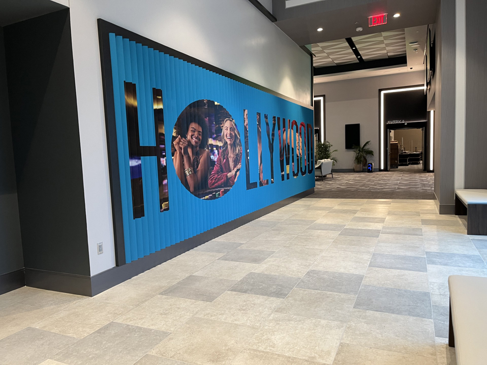 Custom lenticular wall displays installed for workplace branding in Norfolk, VA