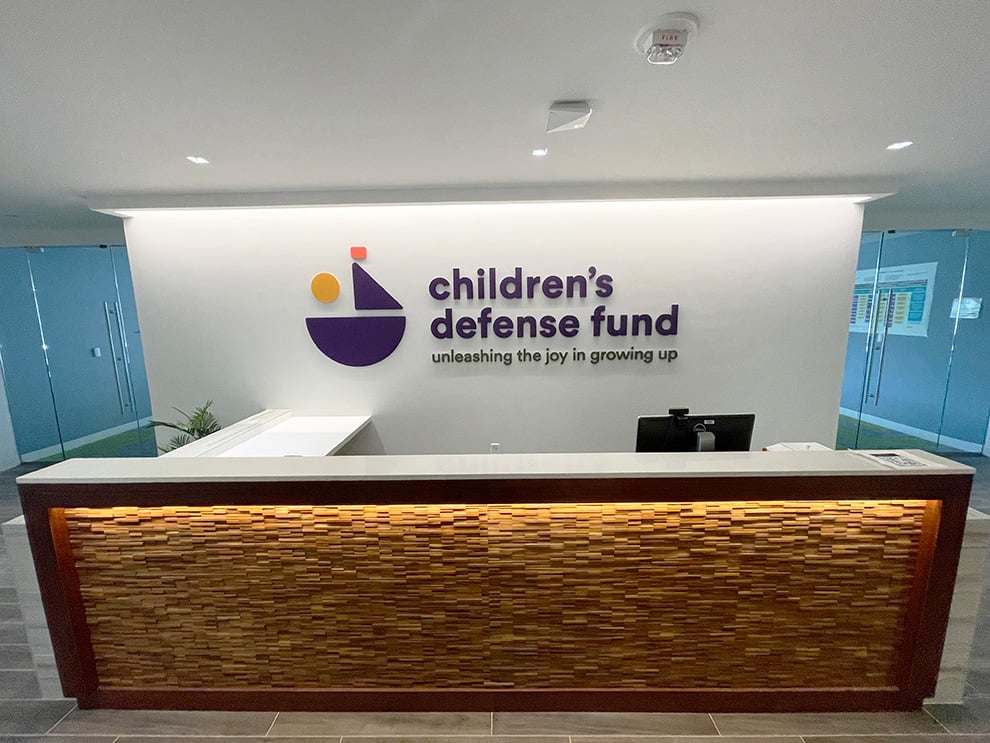 Lobby Signs Cary NC designed and installed to support office branding with interior wall graphic