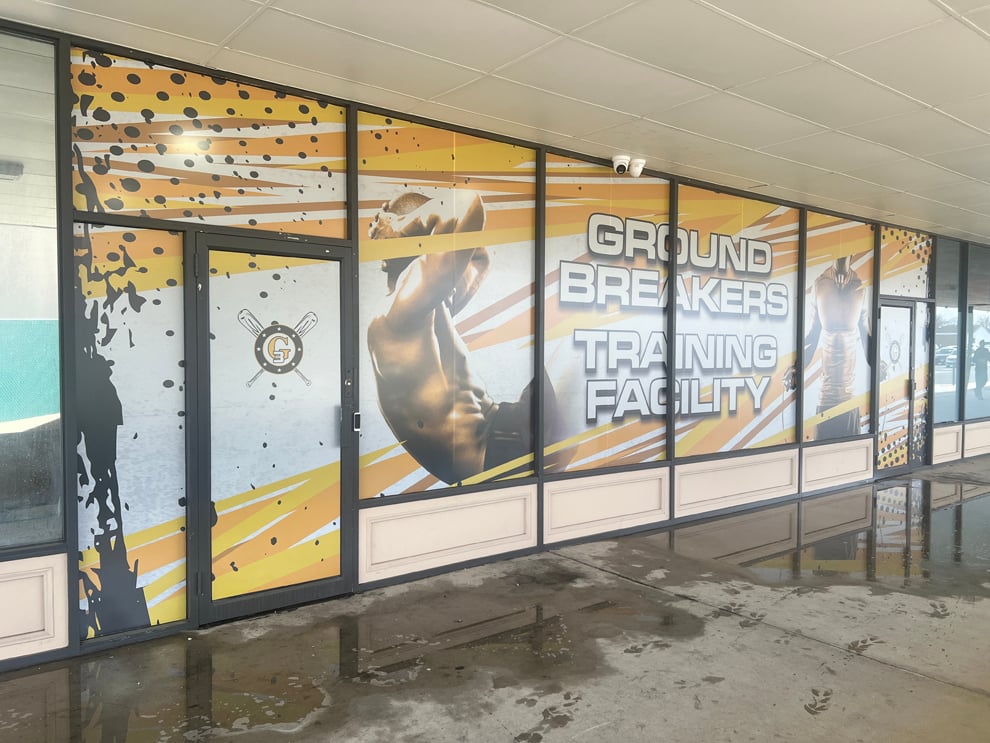 Custom storefront graphics and interior signage for business near Reston, VA