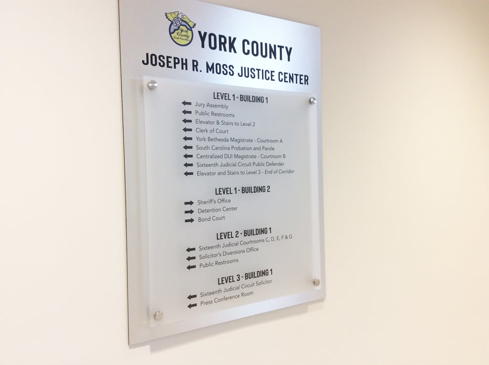 Wayfinding signs and directional graphics guiding workplace navigation in Washington, DC