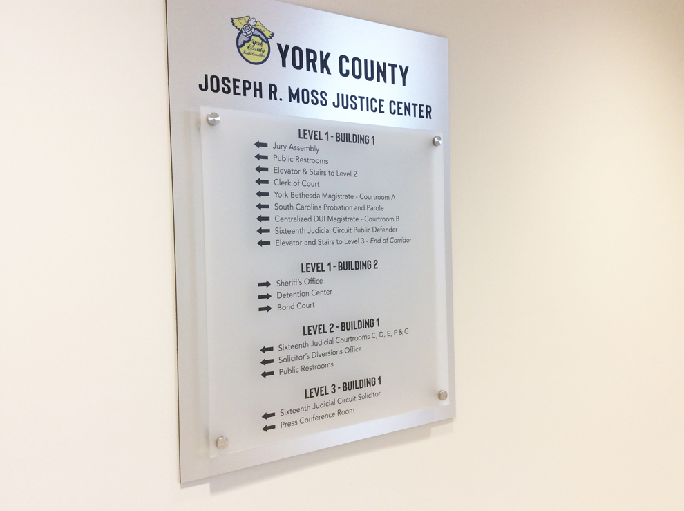 Wayfinding signs and directional graphics guiding workplace navigation in Norfolk, VA