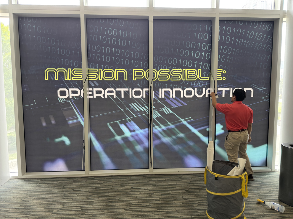 Professional office sign installation with custom graphics in Rockville, MD